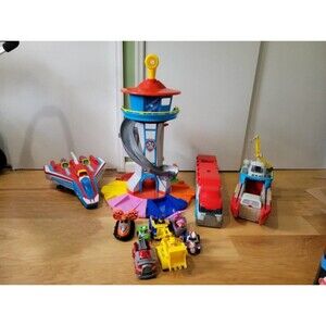 A huge lot of paw patrol toys includes lookout tower, bus, plane, and ship